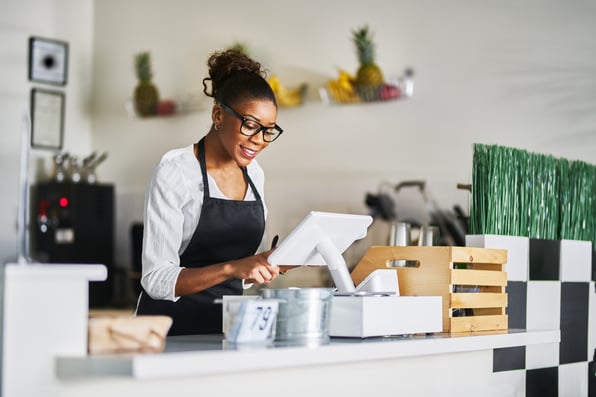 a woman using a POS system integration