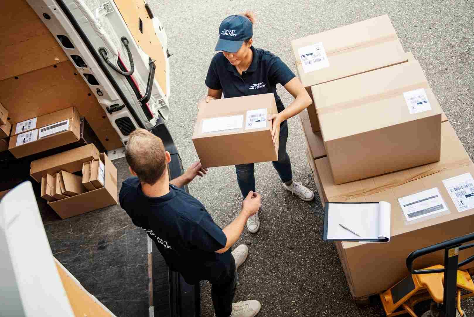 Delivery workers loading parcels