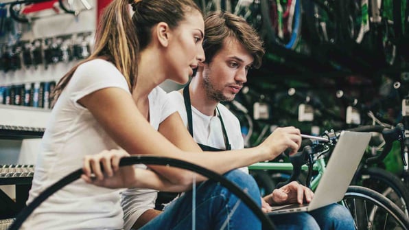 Mechanics with laptop and tools