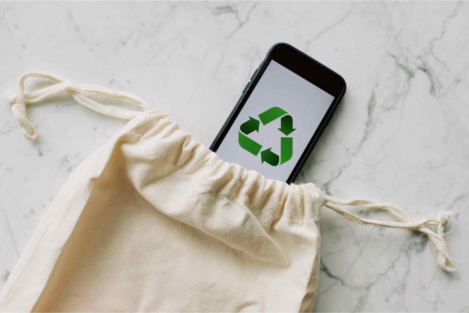 Eco friendly bag and phone with recycle logo