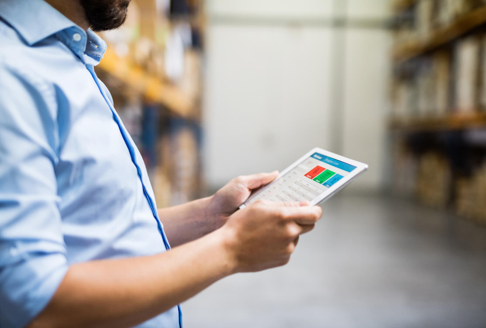 man warehouse worker using a tablet