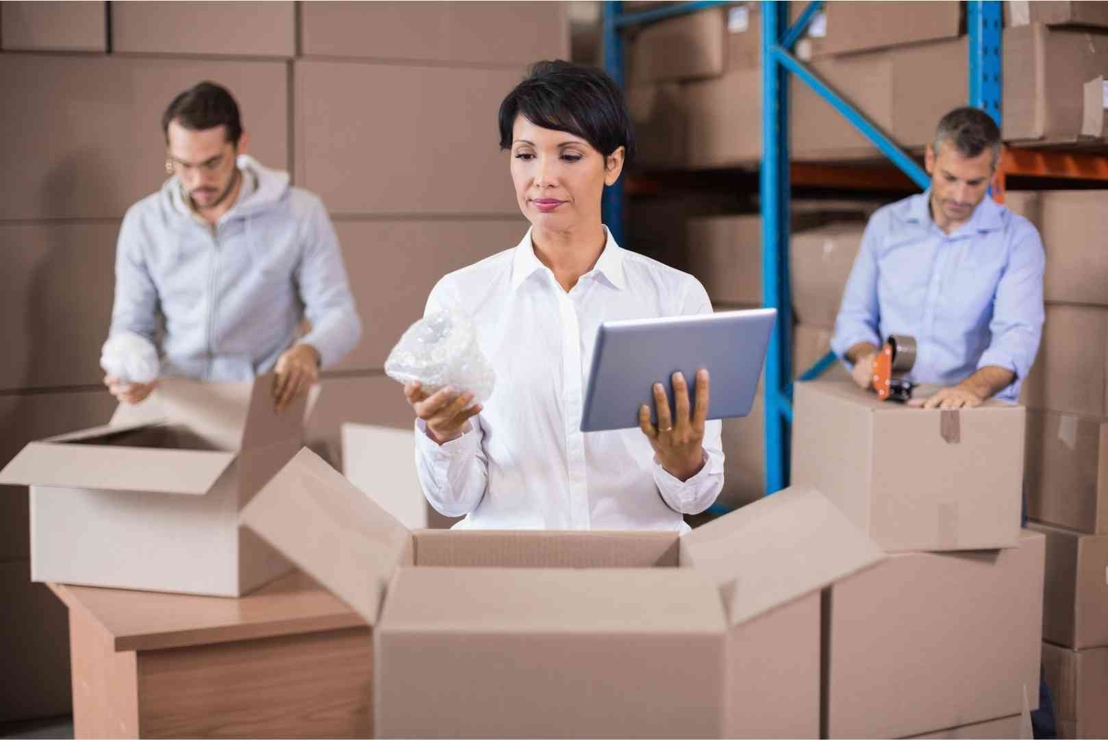 Warehouse workers packing up boxes