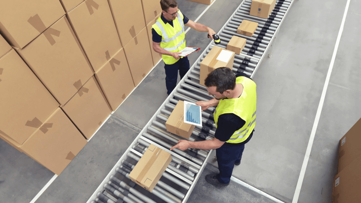 Worker in a warehouse in the logistics sector processing packages