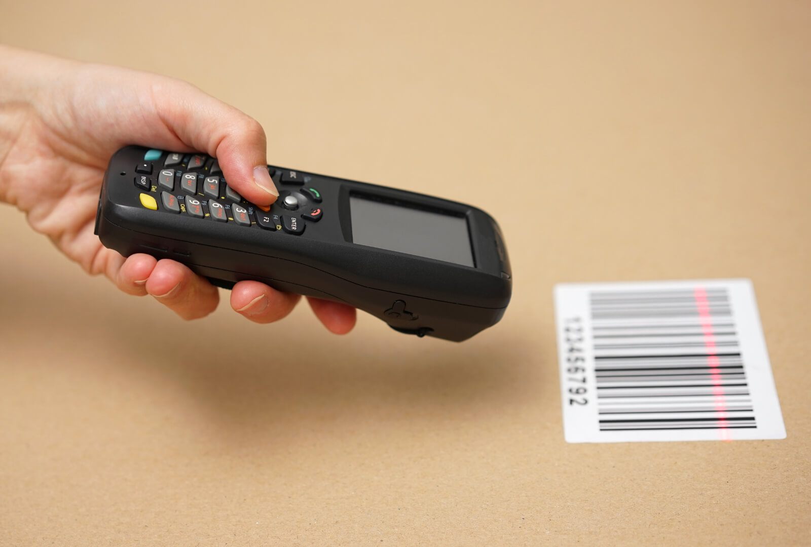 Scanning label on the box with barcode scanner