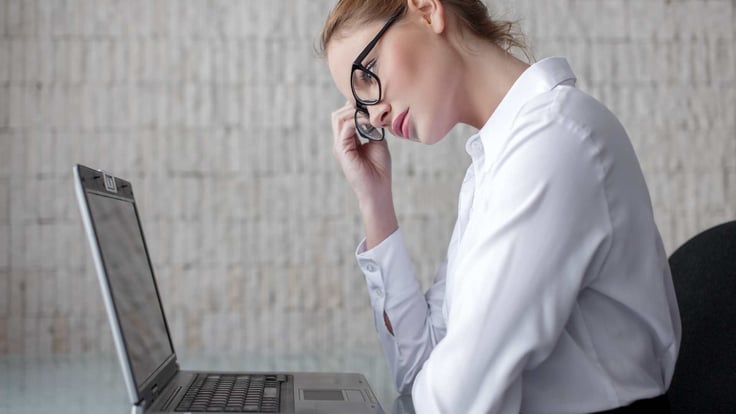 businesswoman thinking at desk