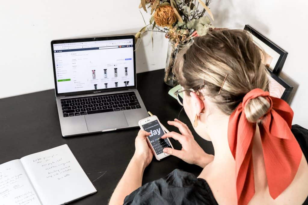 woman using free inventory software on phone
