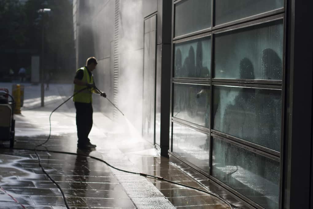 man cleaning warehouse with a Commercial Power Wash