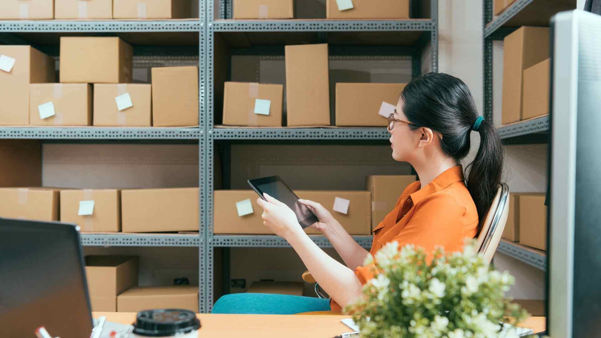 woman holding a tablet at warehouse