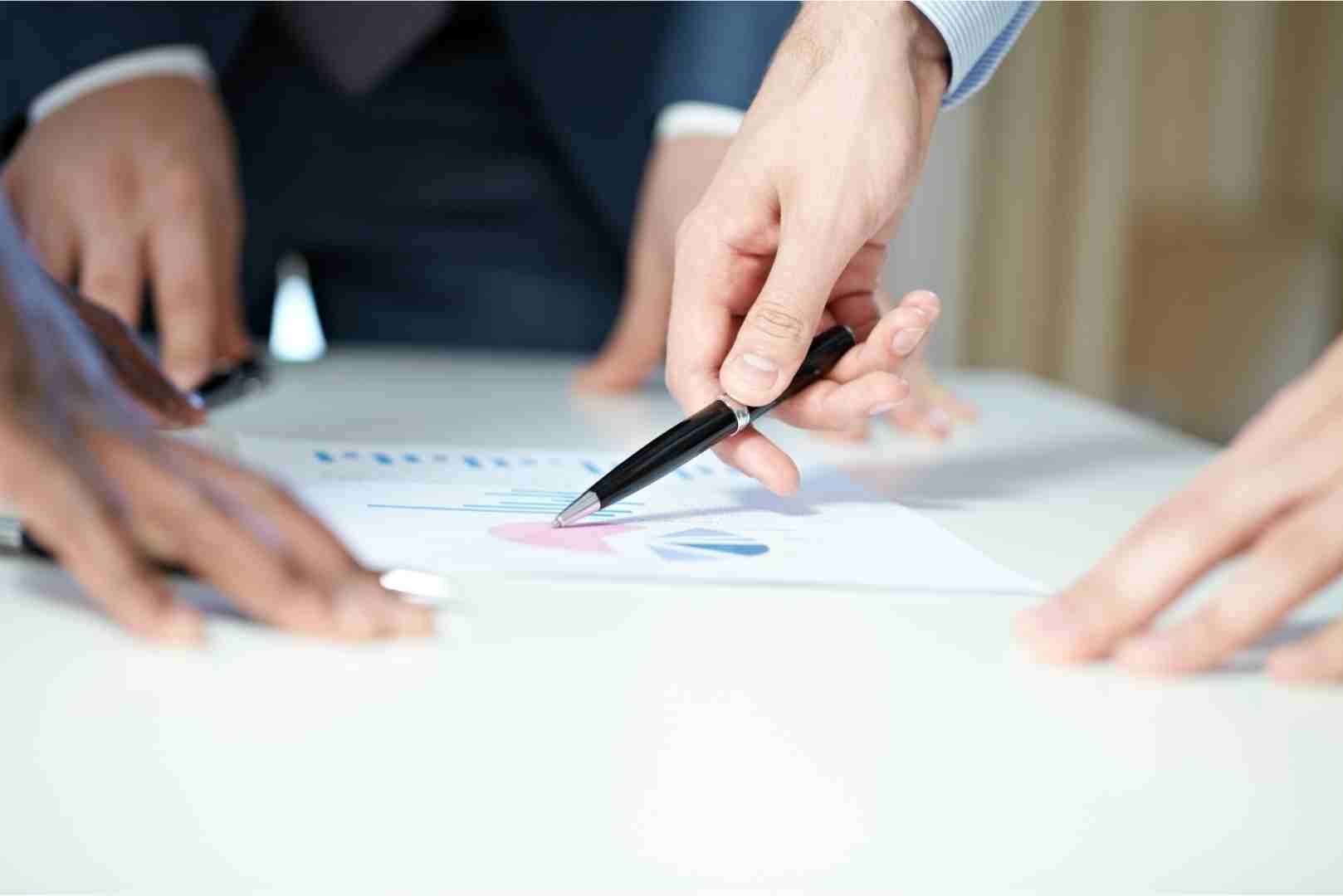 woman pointing to the chart using a pen