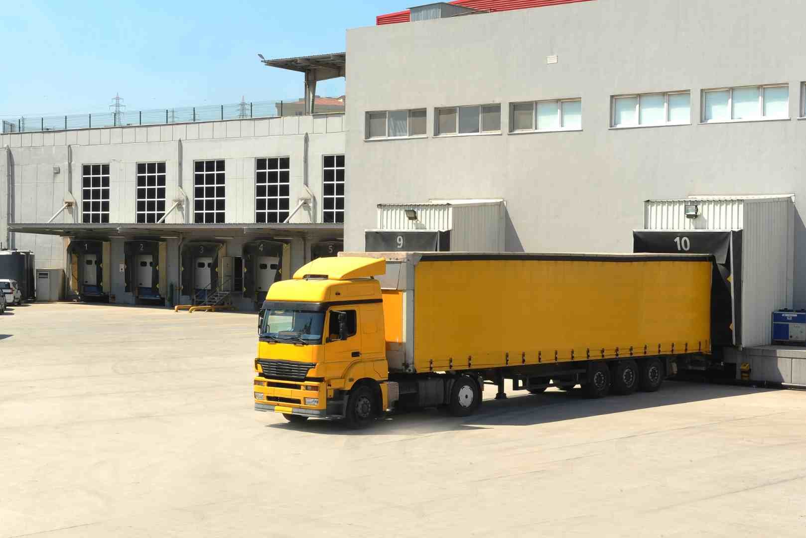 cargo truck at warehouse building