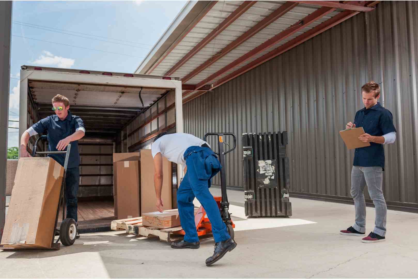 dock workers loading a delivery truck