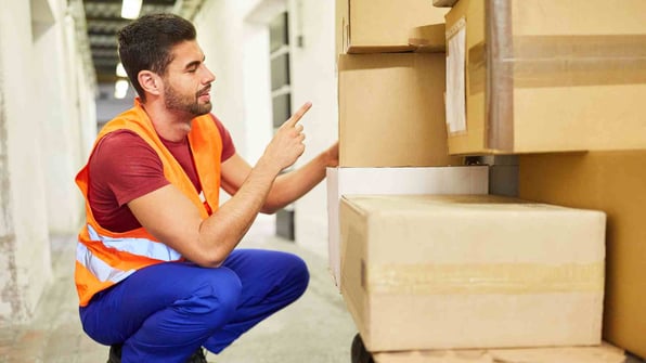 warehouse clerk plans to ship packages
