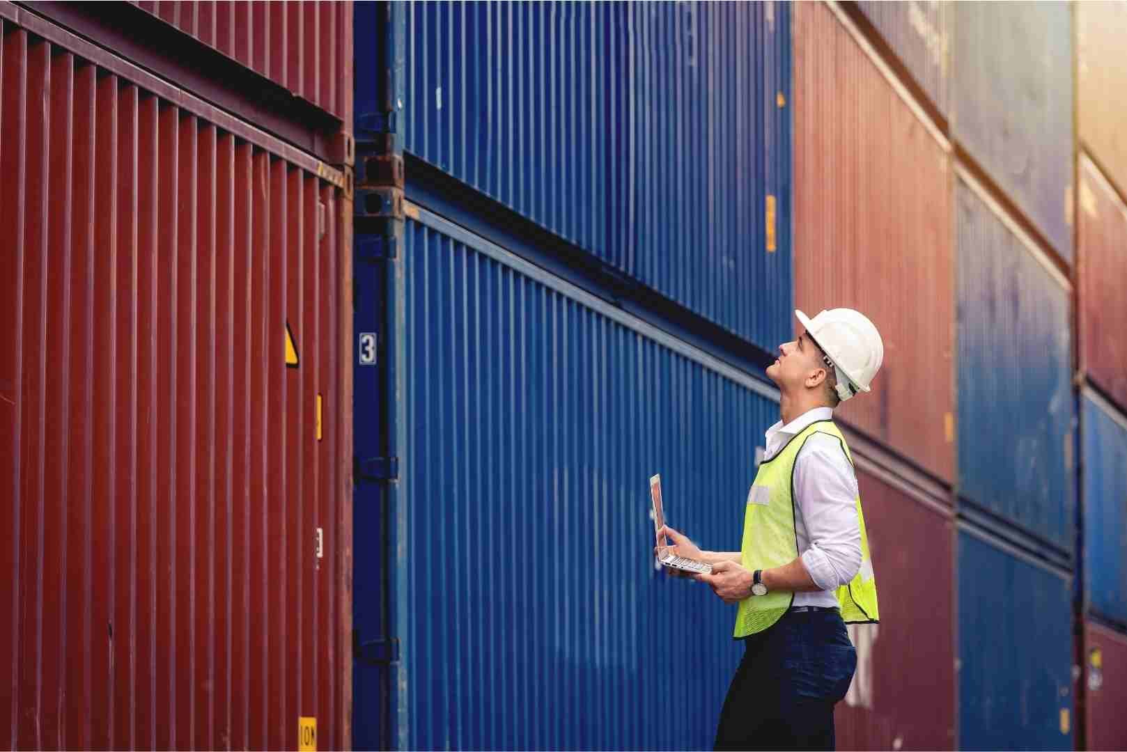 worker checking cargo from the shipyard