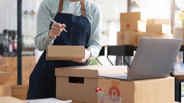 young entrepreneur working with packages for shipping